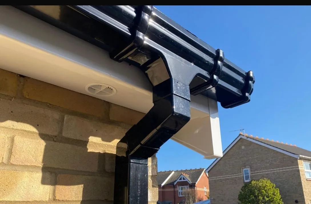 New black guttering and downpipe fitted to a Christchurch home