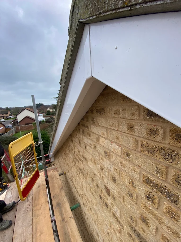 White UPVC fascia fitted beneath a tiled gable roof