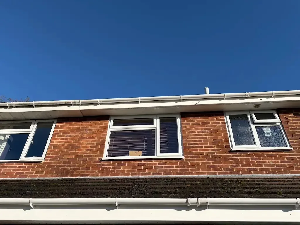 White guttering and soffits installed along a residential roofline